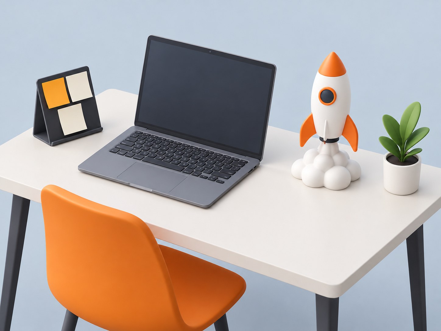 Illustration of a desk with a laptop, a small toy rocket, sticky notes and a desk plant, representing startup jobs in India